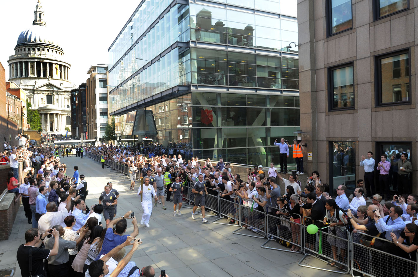 Enthusiastic crowds greet the Olympic Torch Relay as it is carried on to the north side of the Millenium Bridge in central London before being taken by a new torch bearer across the River ThamesÂ© Stefano Cagnoni - reportdigital.co.uk01789 262151 07831 121483info@reportdigital.co.ukwww.reportdigital.co.ukNUJ recommended terms & conditions apply. Moral rights asserted under Copyright Designs & Patents Act 1988. No part of this photo to be stored, reproduced, manipulated or transmitted by any means without permission.